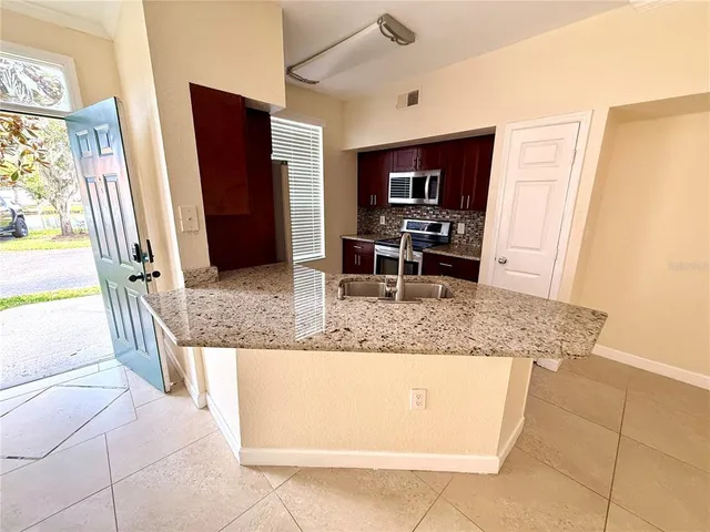 a bathroom with a tub a sink and a shower