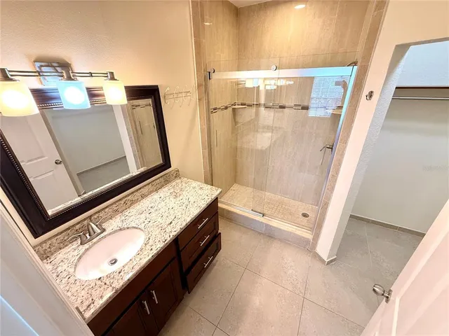 a bathroom with a sink and mirror