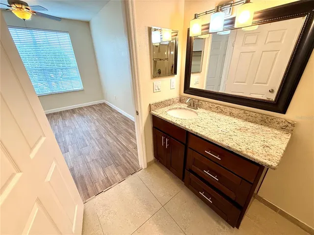a bathroom with a tub and shower