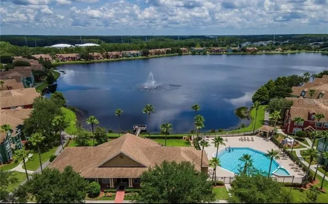 an aerial view of a house with a lake view