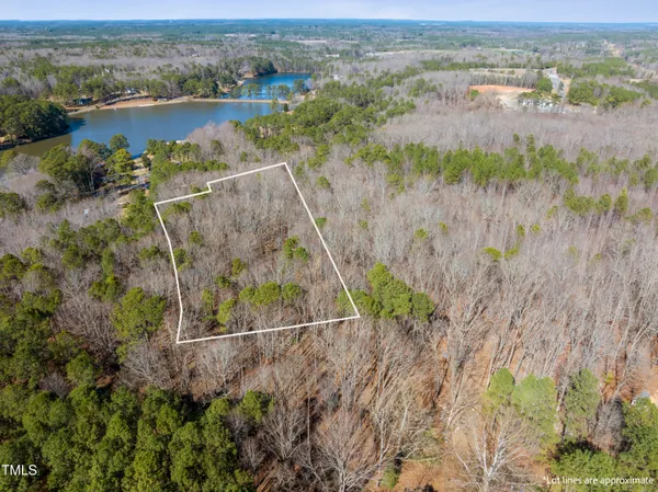 an aerial view of houses with yard