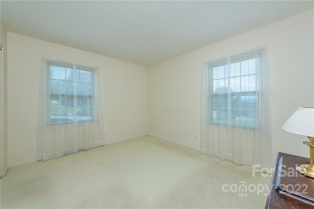 62 Round Top Road Asheville, NC 28803 - Photo 23 of 46 an empty room with windows