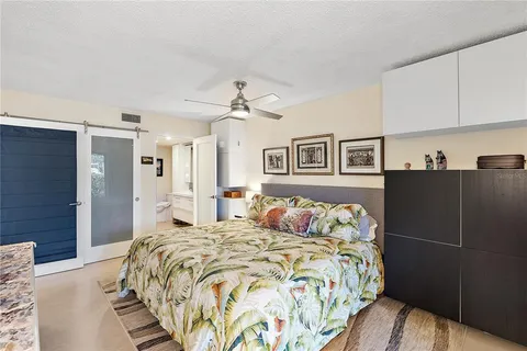 a bedroom with a bed and closet