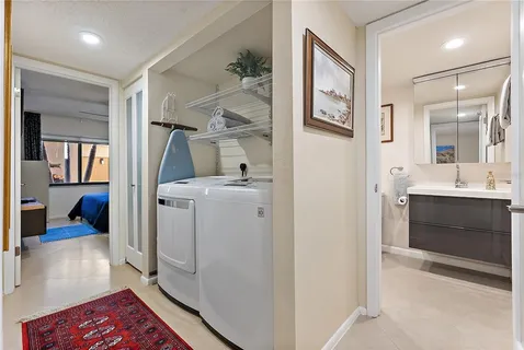 a bathroom with a sink toilet and mirror