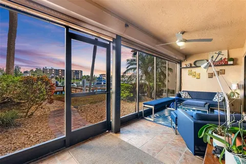a living room filled with furniture and a floor to ceiling window
