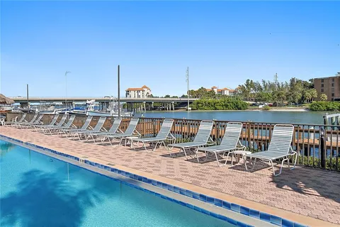 a view of a balcony with chairs