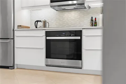 a close view of a stove top oven sitting inside of a kitchen