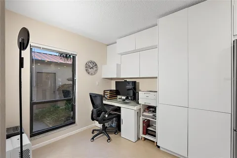 a view of a workspace with furniture