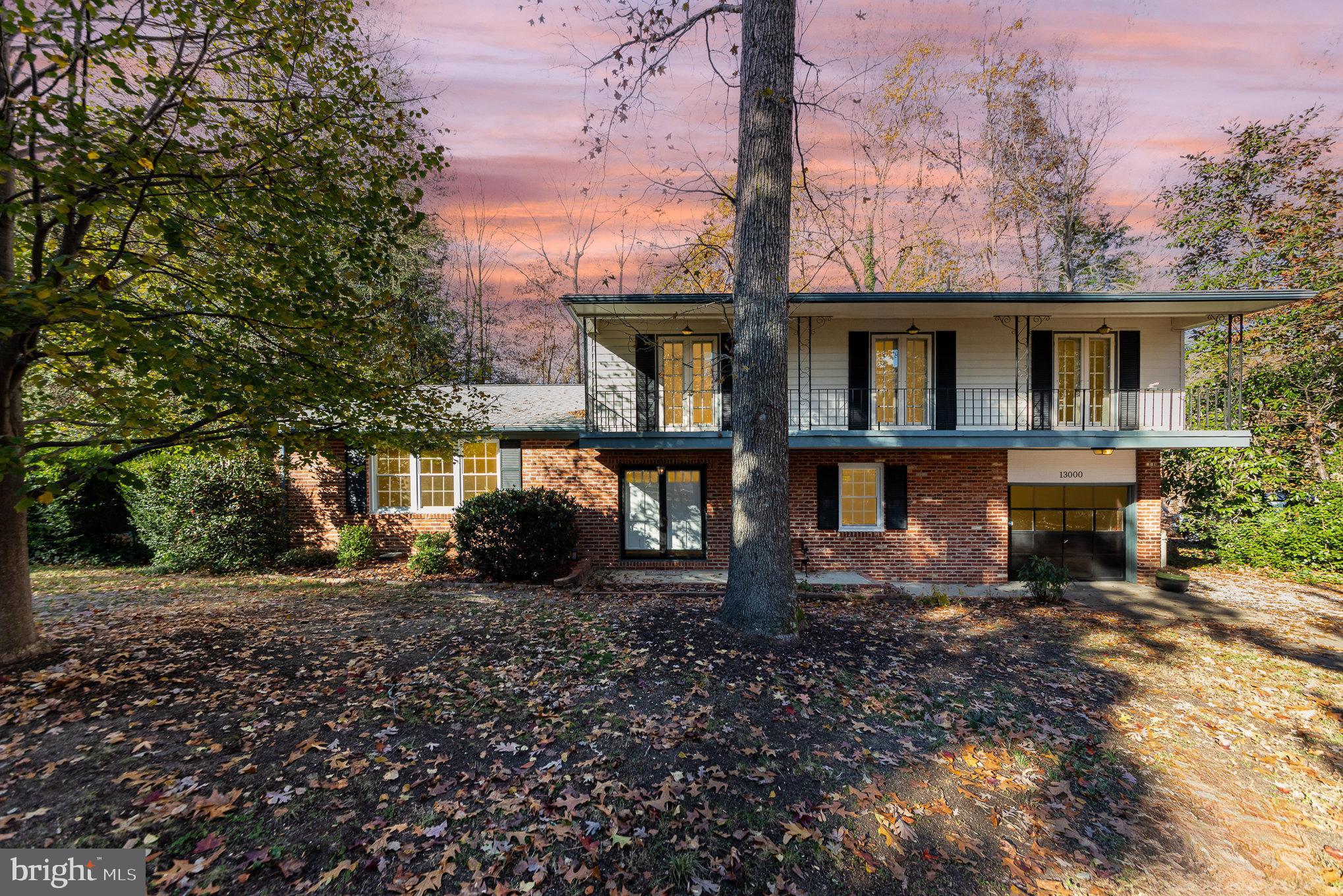 13000 Silver Crest Road Chester, VA 23831 - Photo 1 of 28 a front view of a house with garden