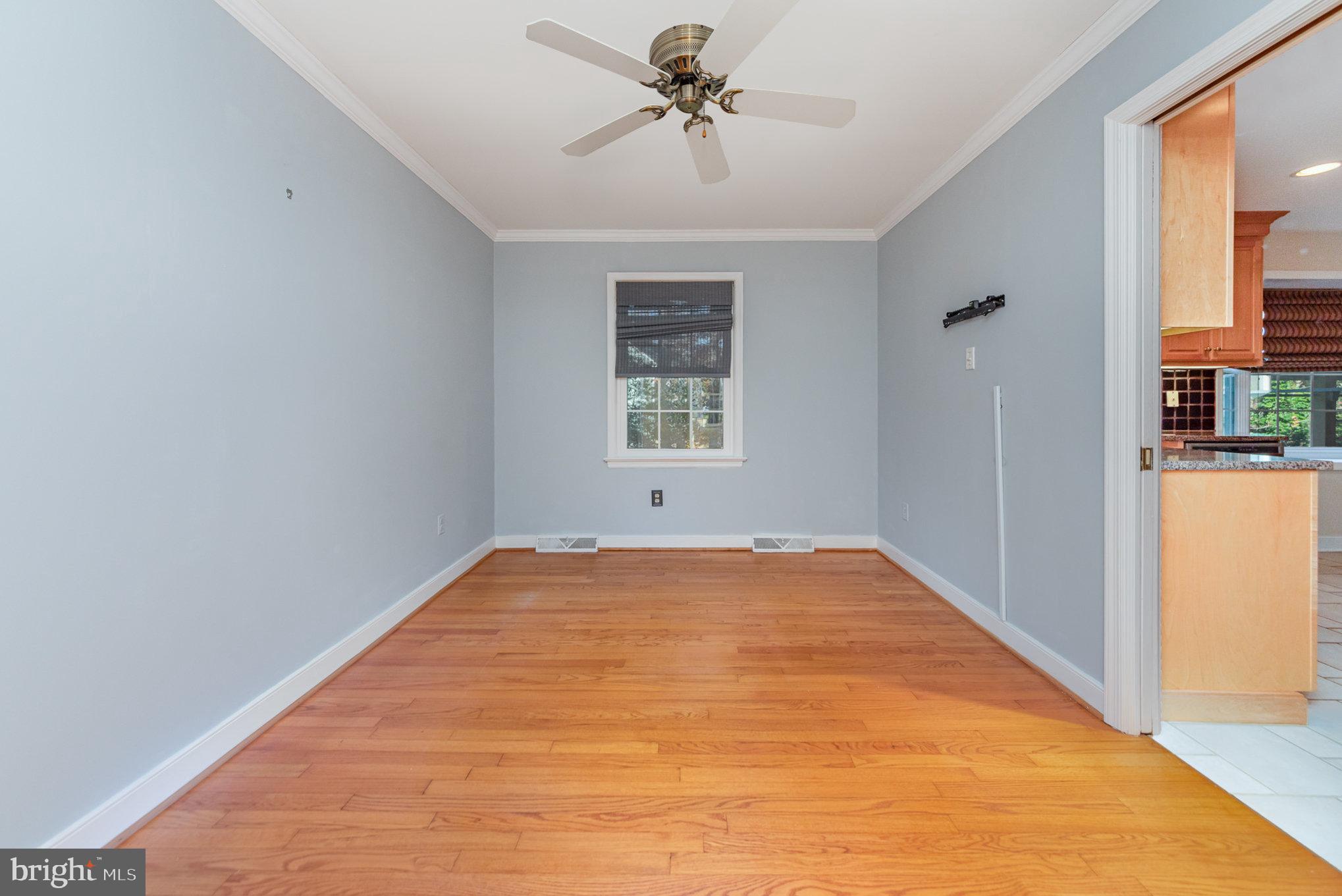 13000 Silver Crest Road Chester, VA 23831 - Photo 13 of 28 a view of a big room with windows and chandelier fan
