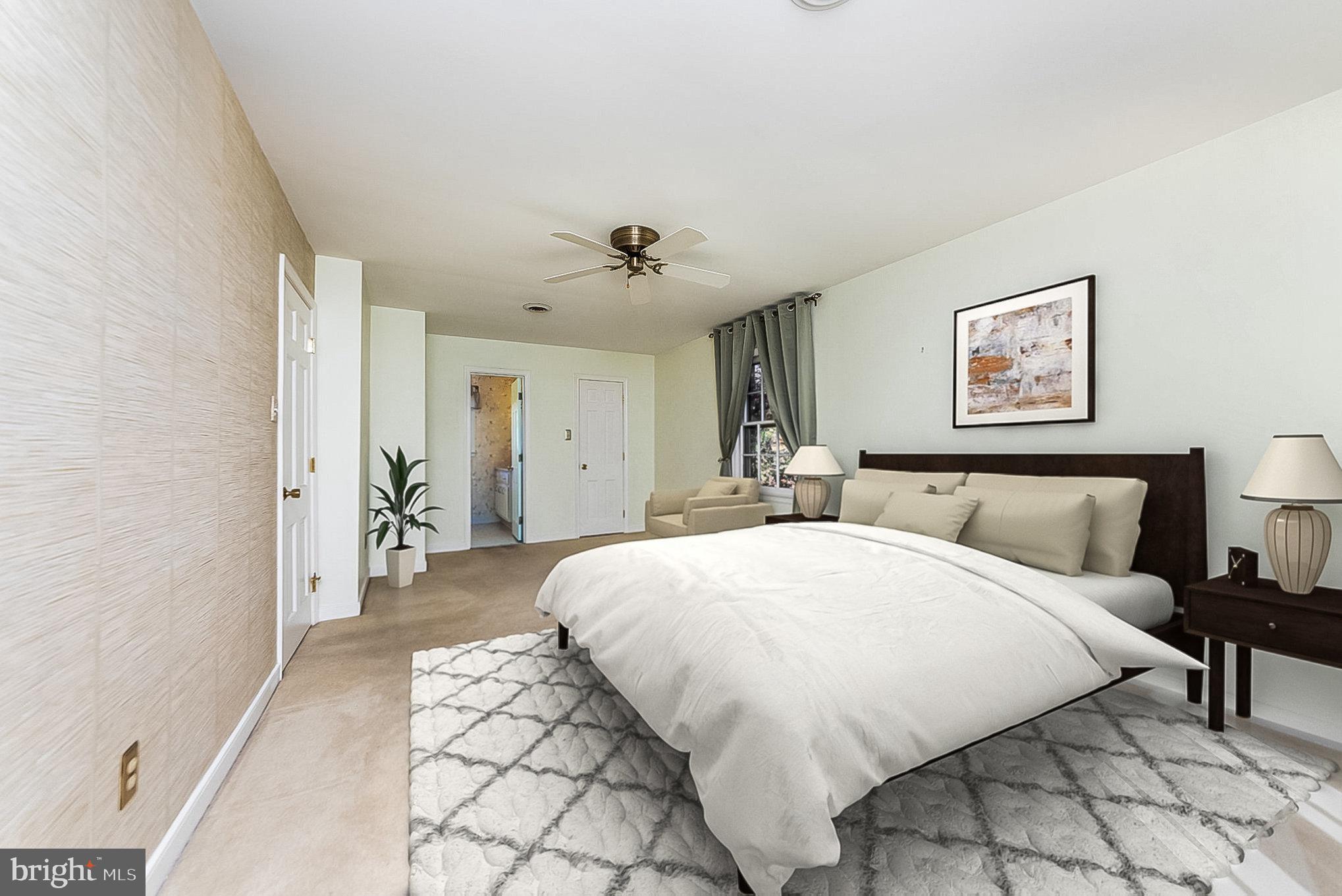 13000 Silver Crest Road Chester, VA 23831 - Photo 16 of 28 a spacious bedroom with a bed and a lamp