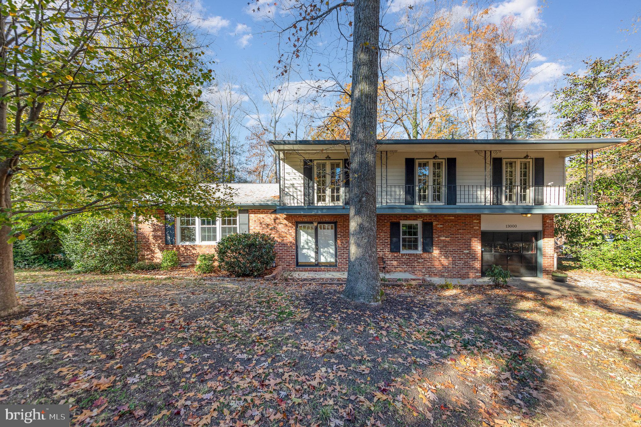 13000 Silver Crest Road Chester, VA 23831 - Photo 2 of 28 a front view of a house with garden