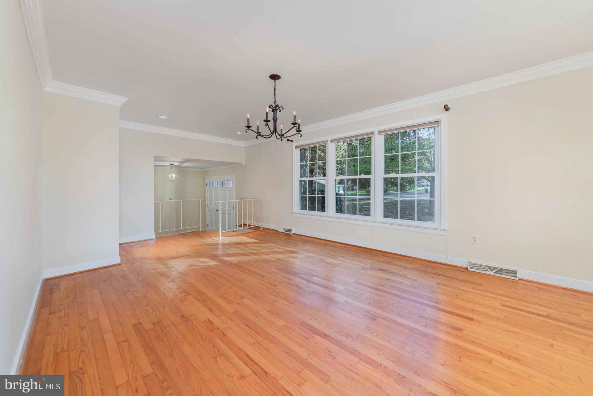 13000 Silver Crest Road Chester, VA 23831 - Photo 4 of 28 a view of empty room with wooden floor and fan
