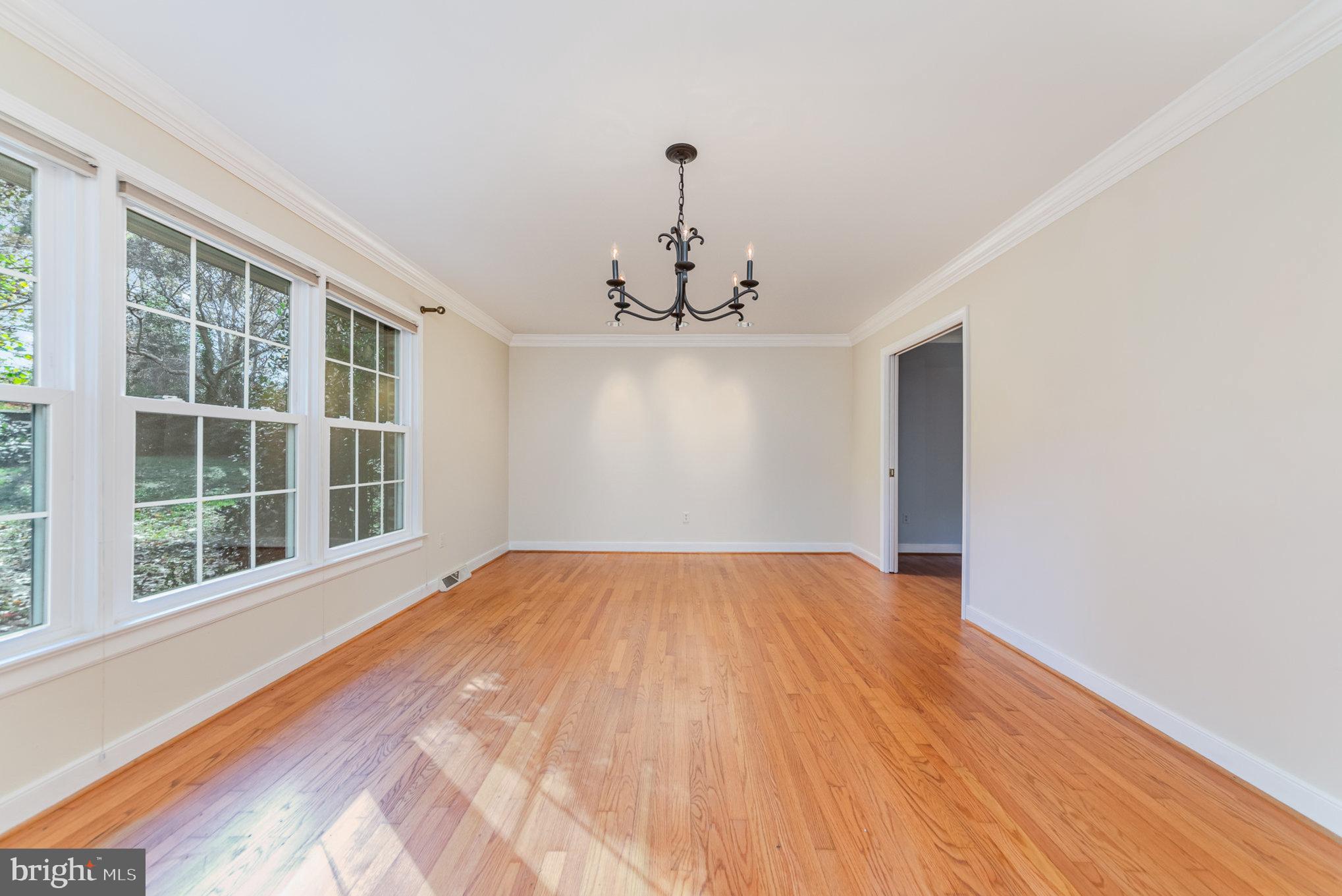 13000 Silver Crest Road Chester, VA 23831 - Photo 5 of 28 a view of empty room with wooden floor and fan
