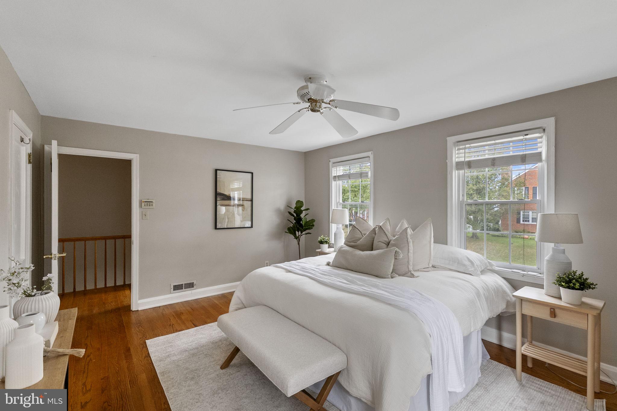 1541 Doxbury Road Baltimore, MD 21286 - Photo 21 of 37 a bedroom with a bed and wooden floor