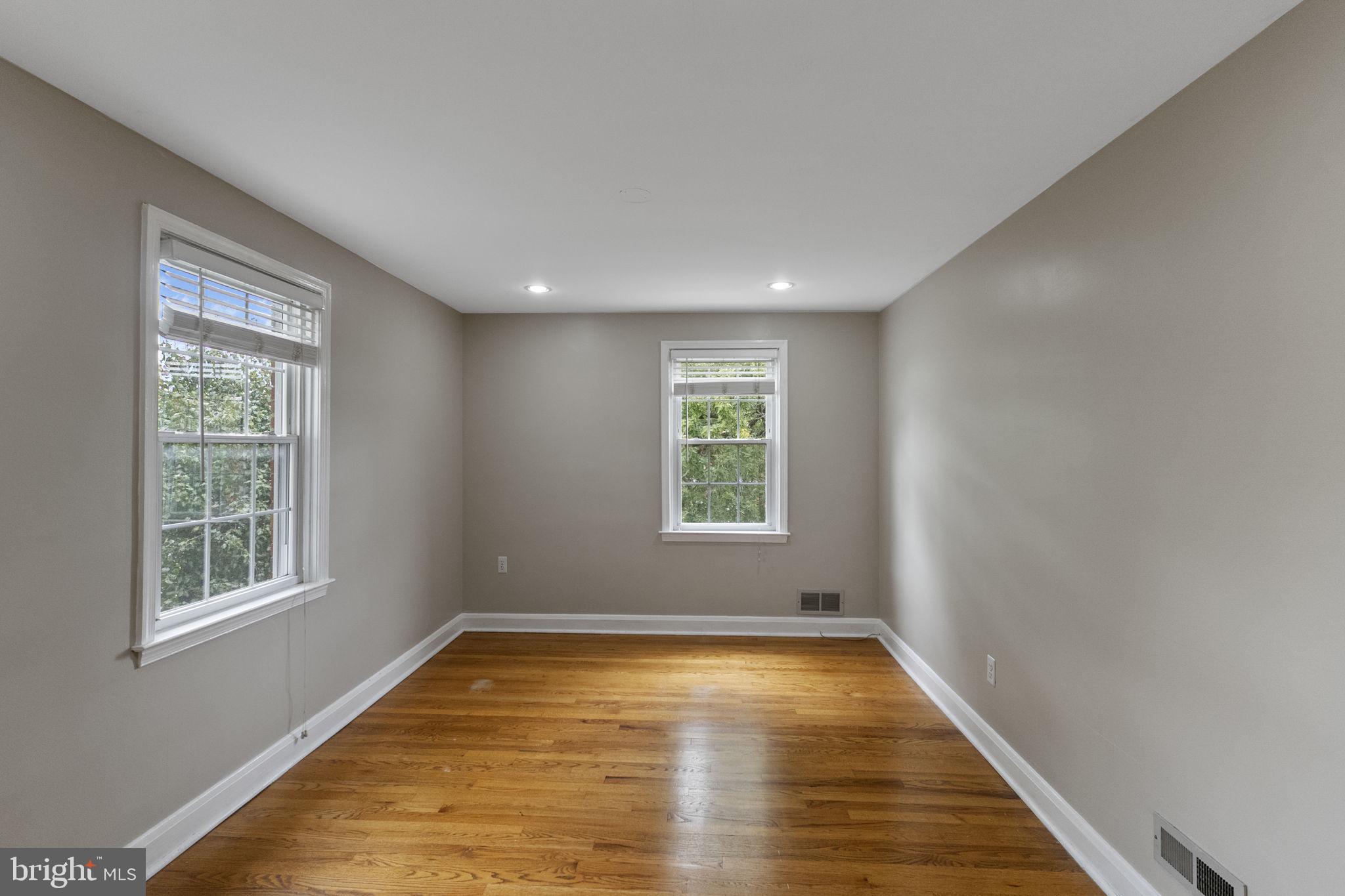 1541 Doxbury Road Baltimore, MD 21286 - Photo 26 of 37 a view of an empty room with wooden floor and a window