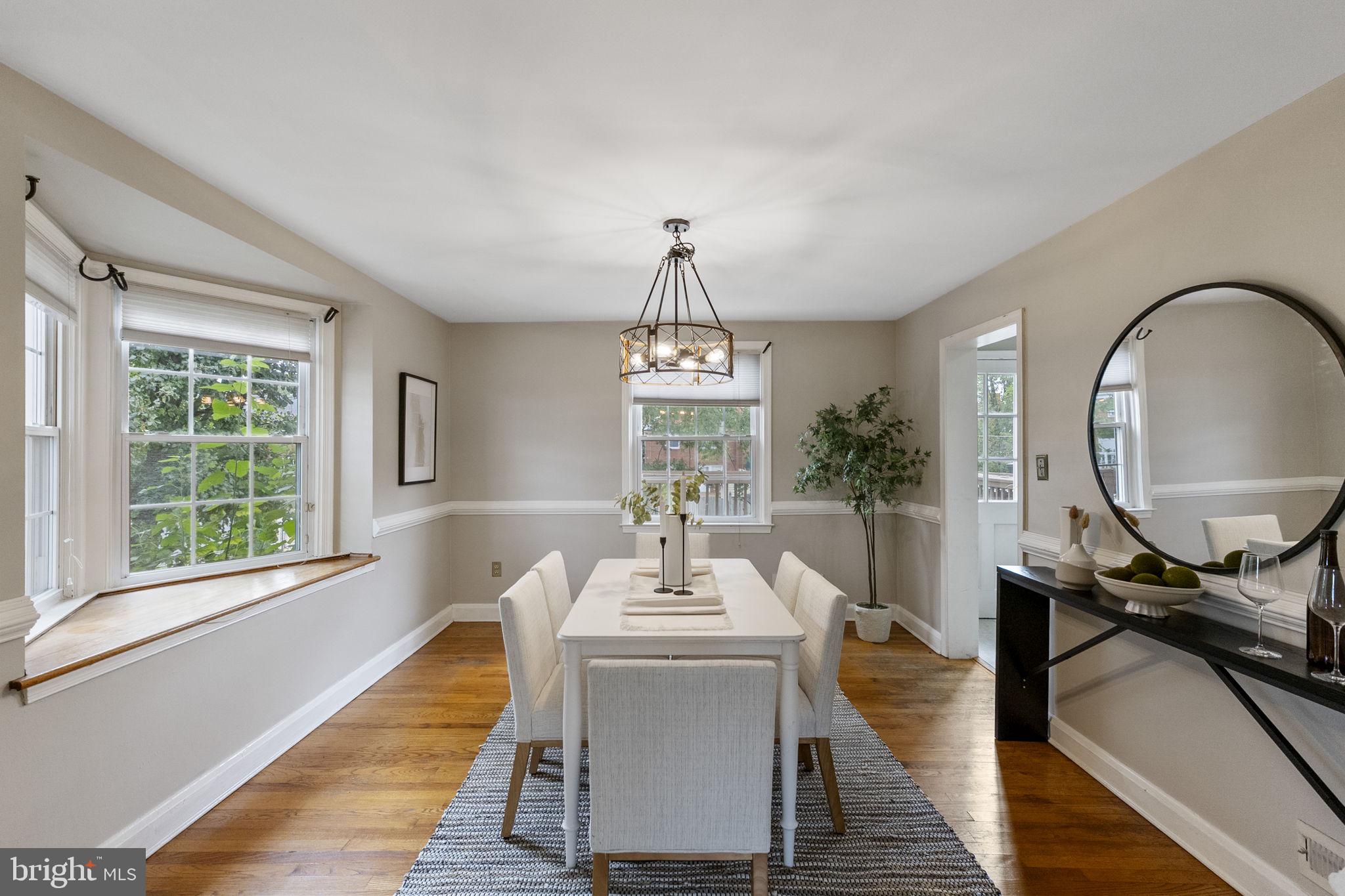 1541 Doxbury Road Baltimore, MD 21286 - Photo 8 of 37 a view of a dining room with furniture window and wooden floor
