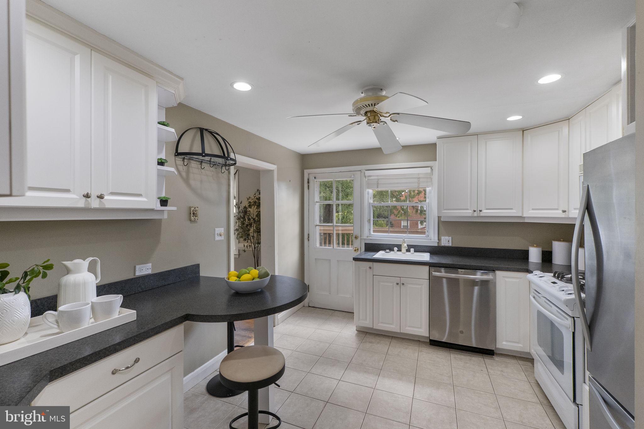 1541 Doxbury Road Baltimore, MD 21286 - Photo 10 of 37 a kitchen with stainless steel appliances a sink stove and cabinets