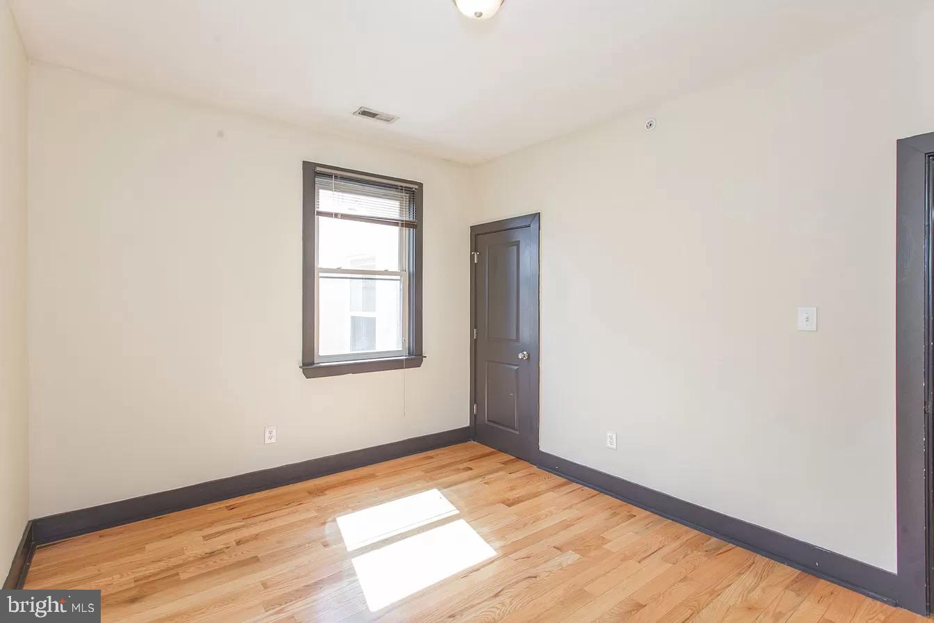 1826 West Norris Street, Unit 2 Philadelphia, PA 19121 - Photo 16 of 23 a view of an empty room and window