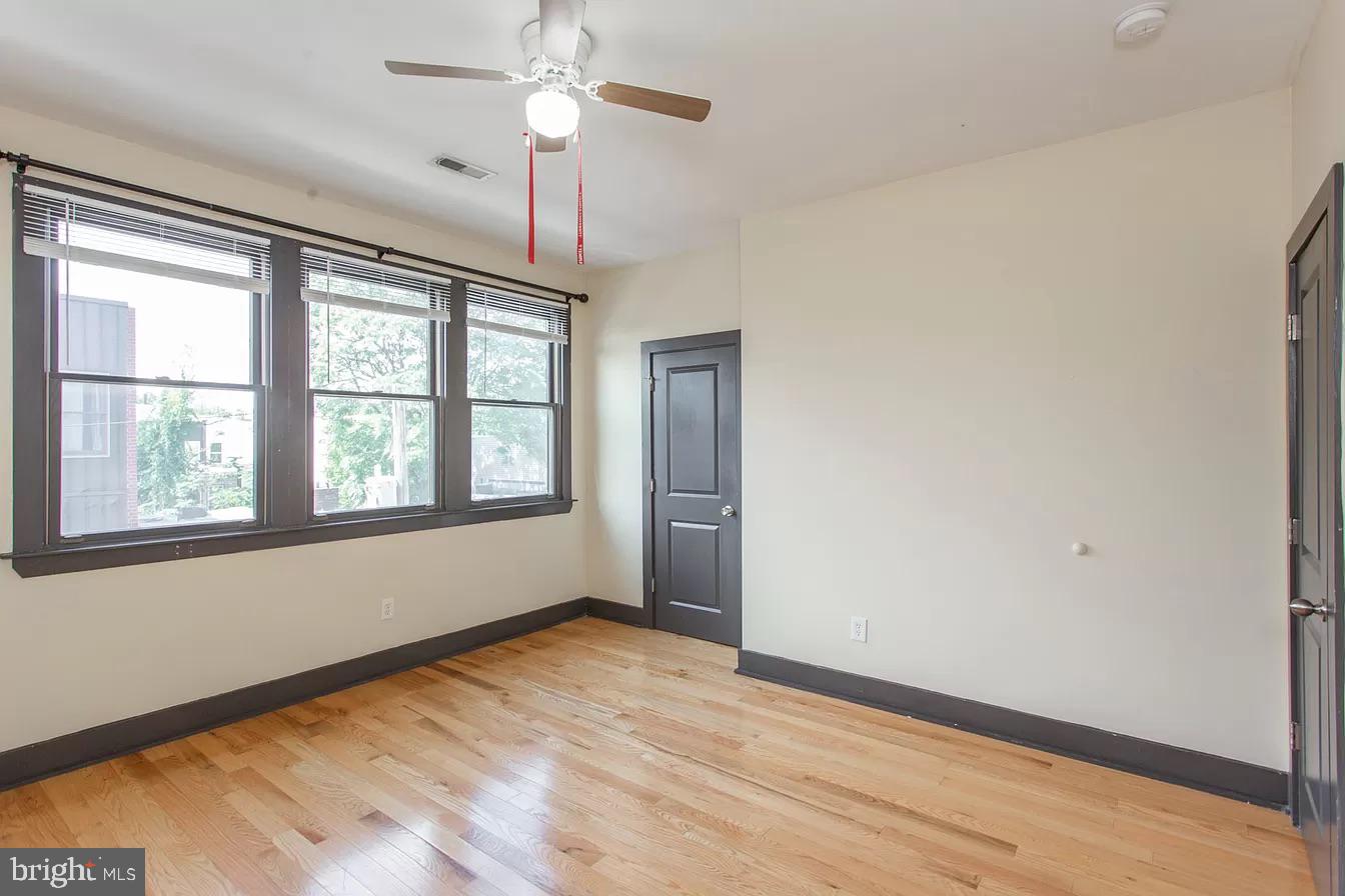 1826 West Norris Street, Unit 2 Philadelphia, PA 19121 - Photo 21 of 23 a view of an empty room with a window