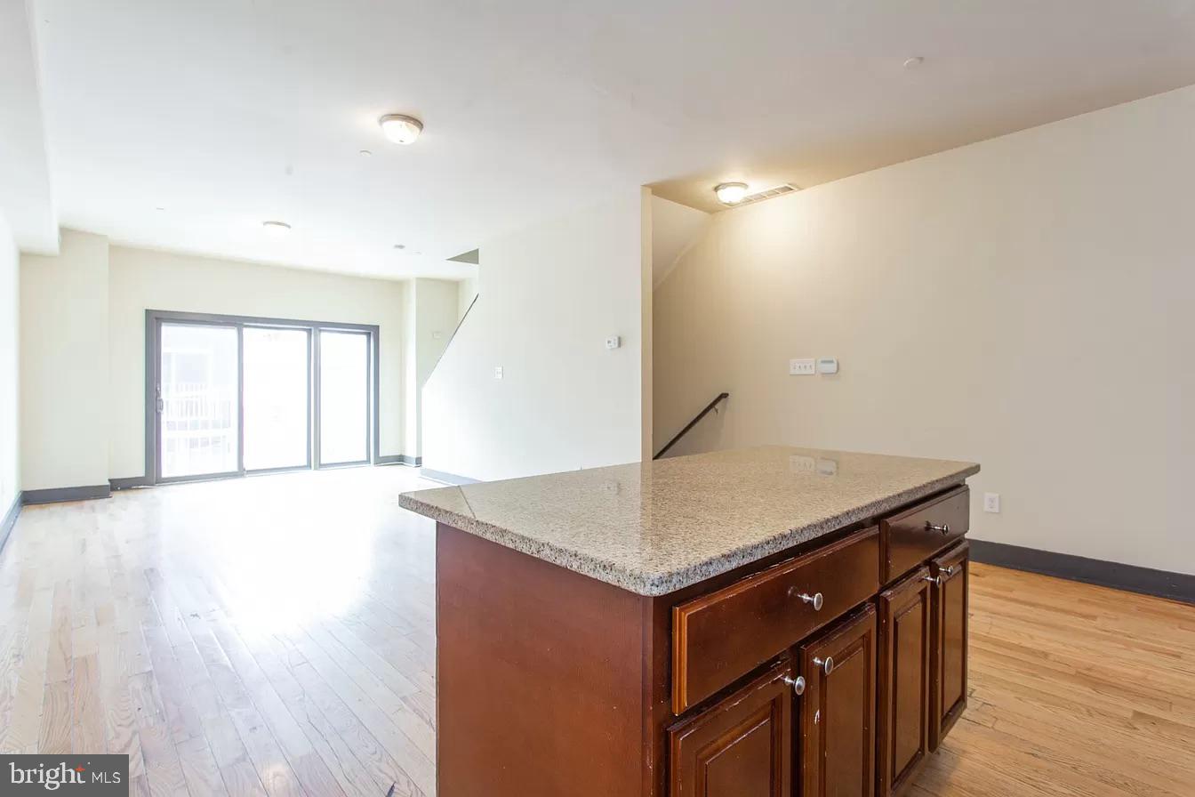 1826 West Norris Street, Unit 2 Philadelphia, PA 19121 - Photo 5 of 23 a kitchen with a wooden floor and a window