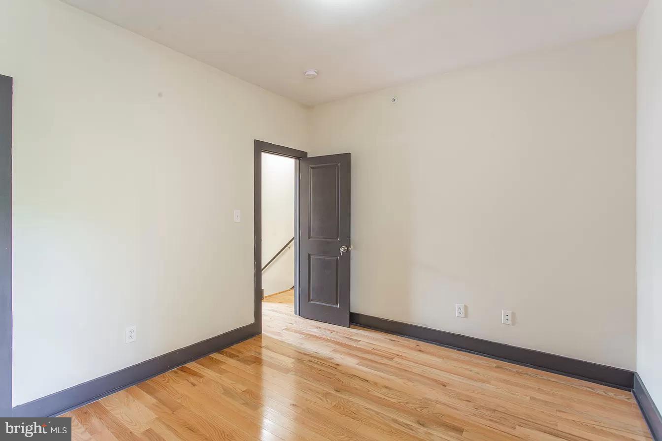1826 West Norris Street, Unit 2 Philadelphia, PA 19121 - Photo 9 of 23 a view of an empty room with wooden floor