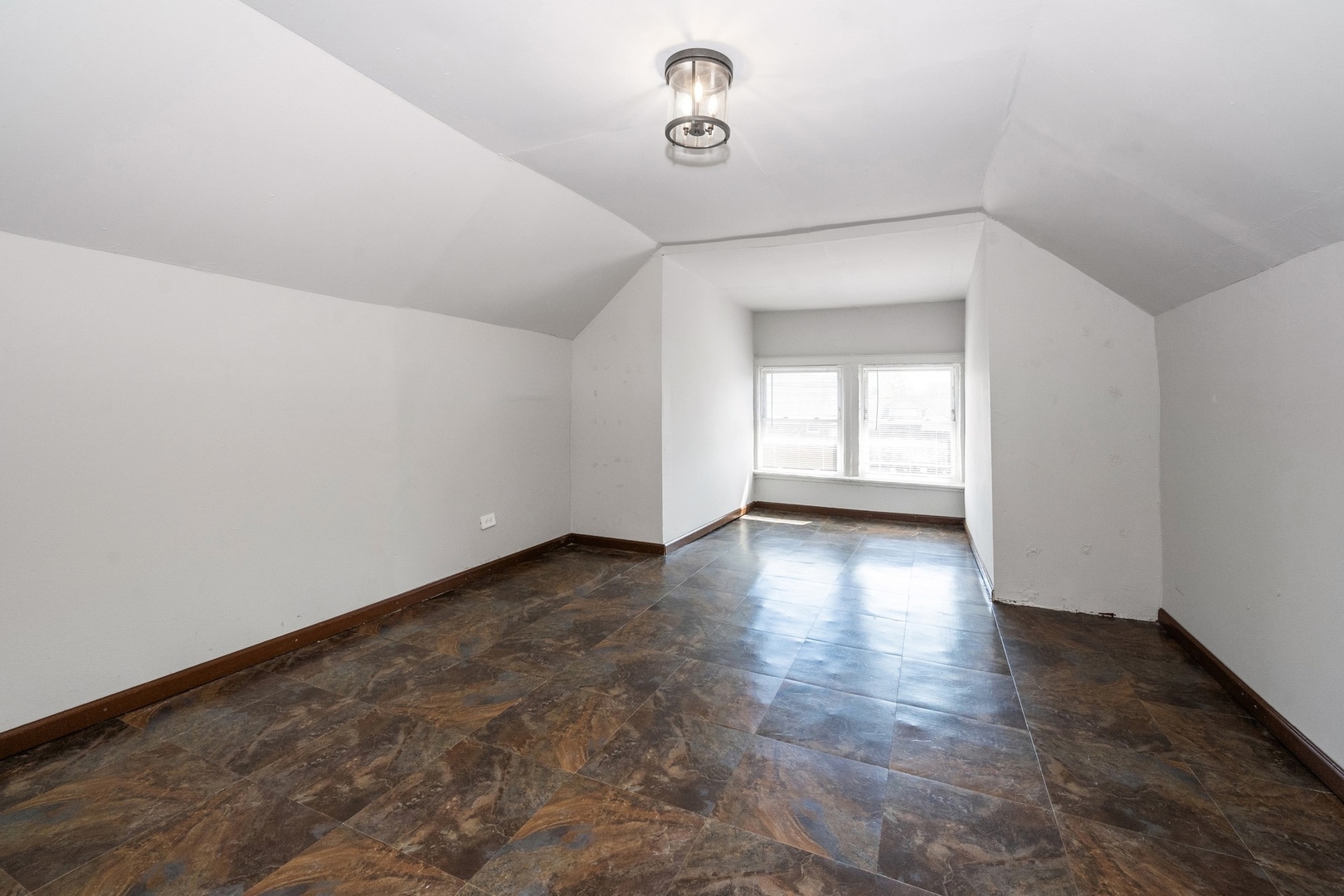 7348 South Indiana Avenue Chicago, IL 60619 - Photo 7 of 11 a view of a livingroom with wooden floor and a window