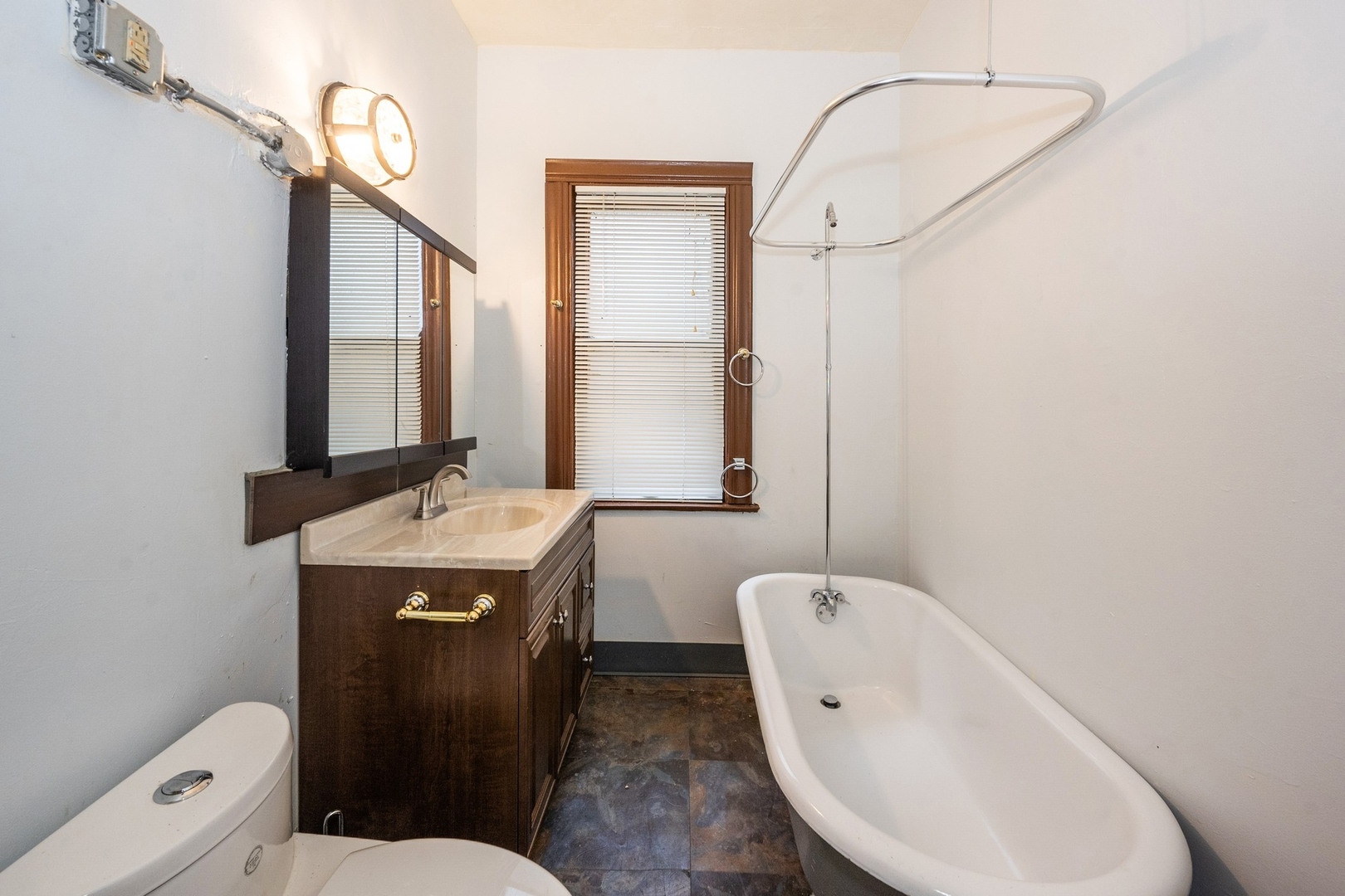 7348 South Indiana Avenue Chicago, IL 60619 - Photo 8 of 11 a bathroom with a toilet sink and mirror