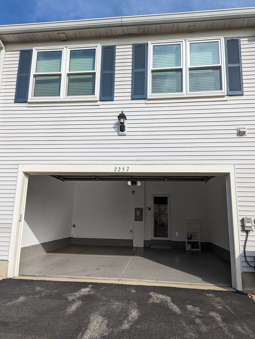 2257 Georgetown Circle Aurora, IL 60503 - Photo 16 of 19 a view of a house with a parking space