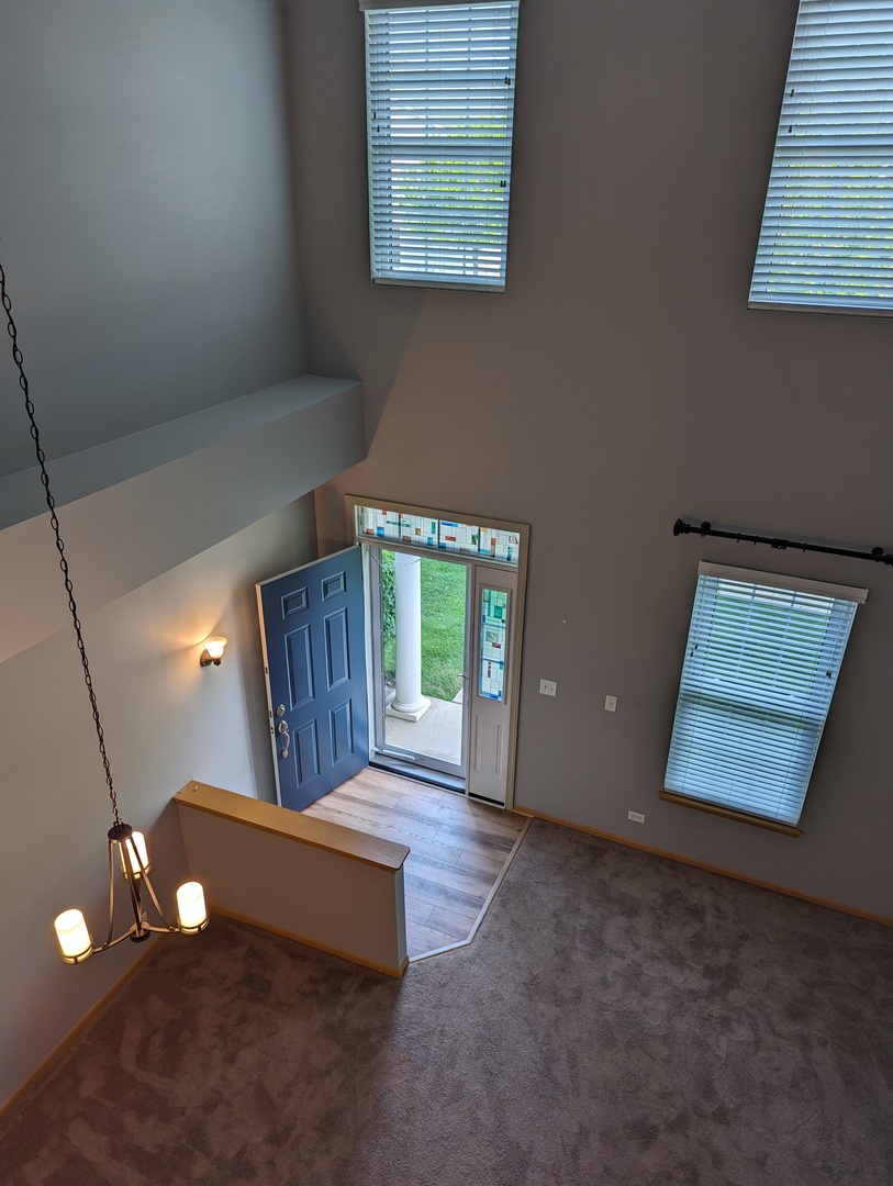 2257 Georgetown Circle Aurora, IL 60503 - Photo 2 of 19 a room with window and a table