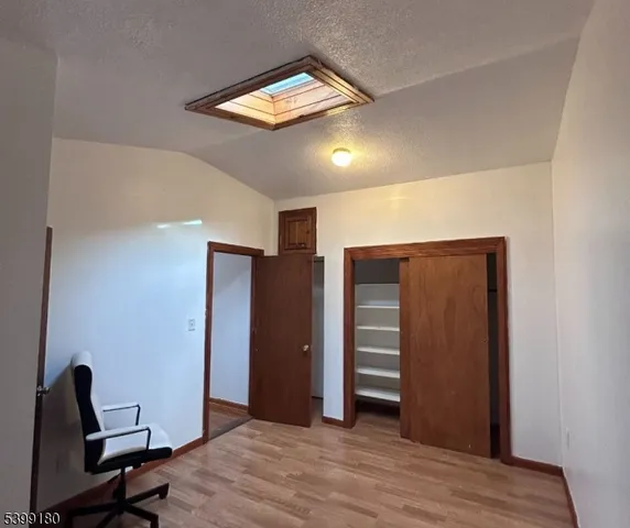 a view of a livingroom with a workspace