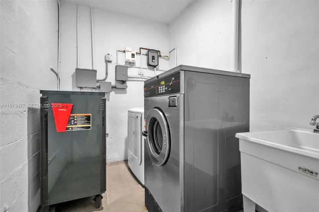 a utility room with dryer and washer
