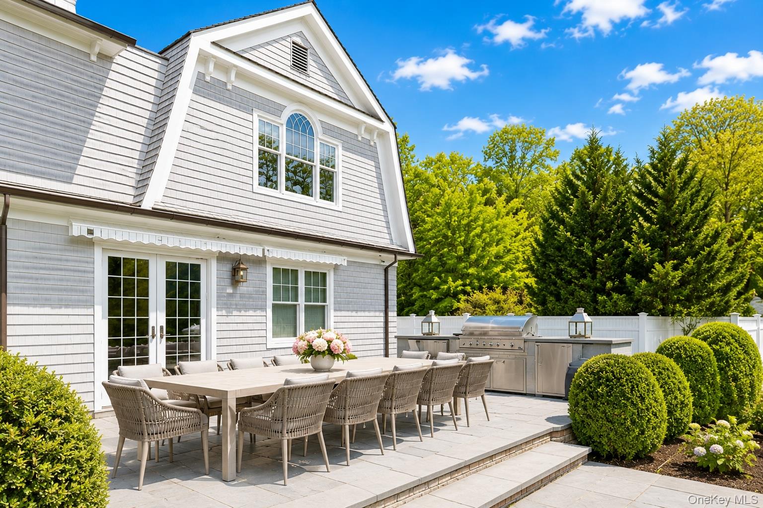 486 Middle Line Highway Bridgehampton, NY 11976 - Photo 25 of 28 a view of a patio with table and chairs and potted plants