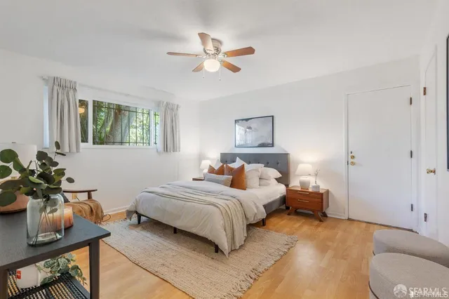 a bedroom with a bed and a couch