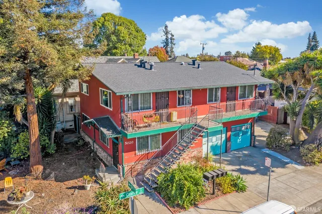 an aerial view of a house with swimming pool