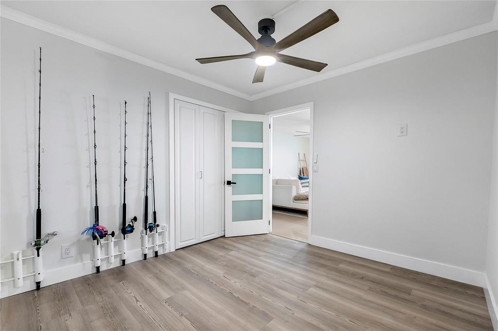 1505 North Riverside Drive, Unit 1003 Pompano Beach, FL 33062 - Photo 11 of 33 wooden floor in an empty room with a window
