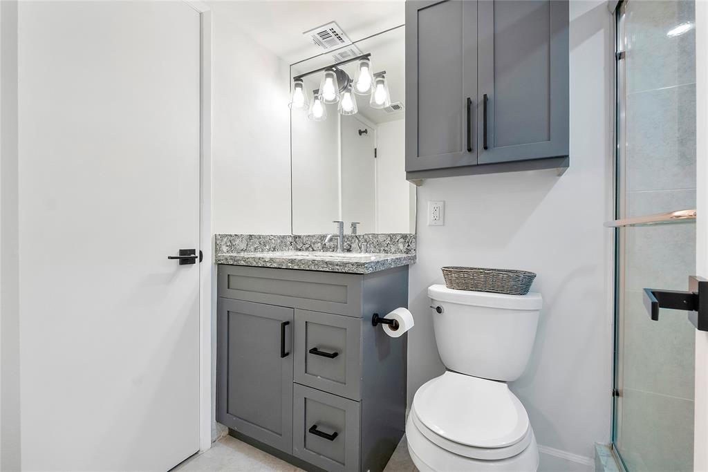 1505 North Riverside Drive, Unit 1003 Pompano Beach, FL 33062 - Photo 13 of 33 a bathroom with a toilet a sink and mirror