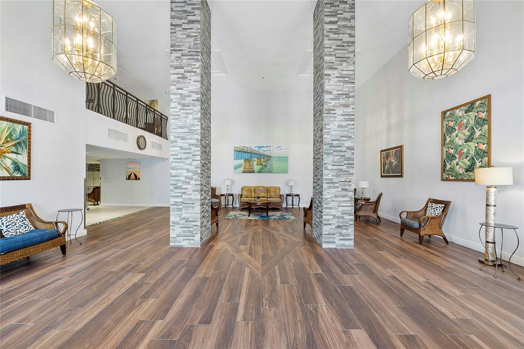 1505 North Riverside Drive, Unit 1003 Pompano Beach, FL 33062 - Photo 17 of 33 a living room with furniture and a wooden floor