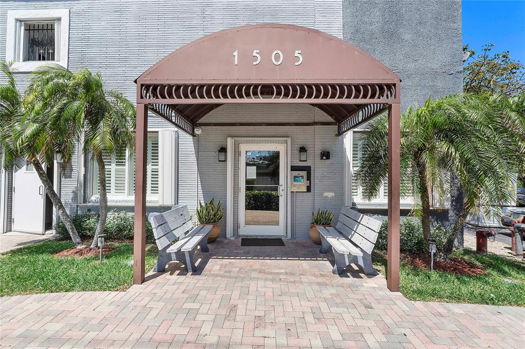 1505 North Riverside Drive, Unit 1003 Pompano Beach, FL 33062 - Photo 18 of 33 a front view of a house with garden and seating area