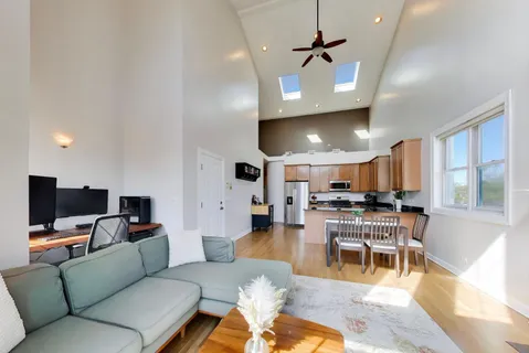 a living room with lots of furniture and a flat screen tv