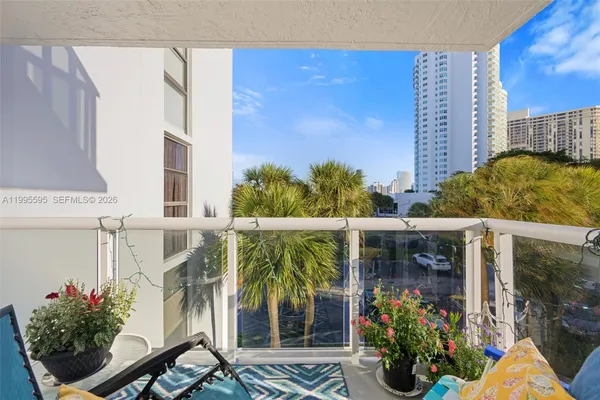 a view of a potted flower in front of a house