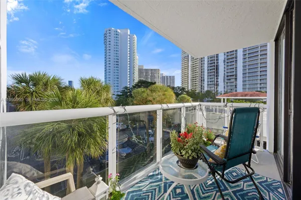 a view of a chairs and table in the patio