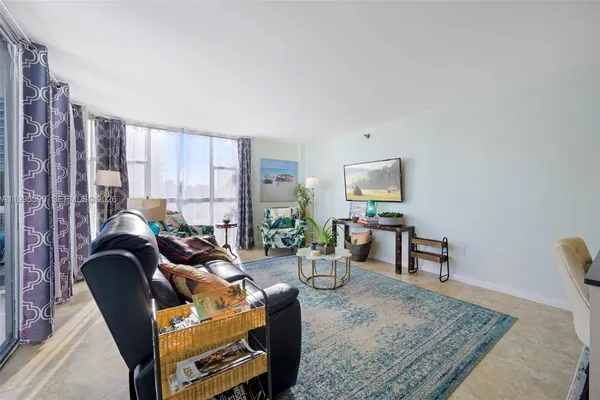 a living room with furniture and a rug