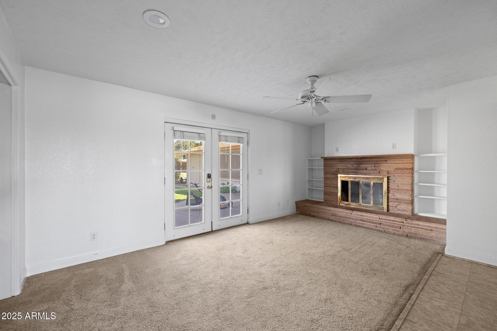 333 South Cooper Road Chandler, AZ 85225 - Photo 20 of 68 an empty room with windows and fireplace