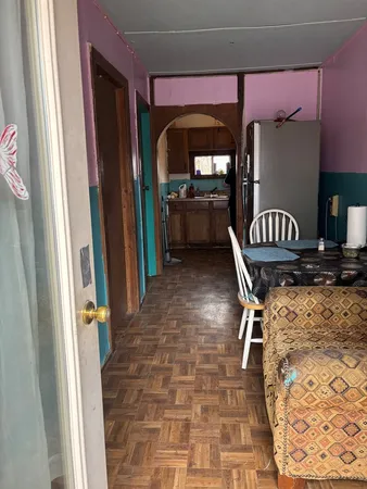a view of a entryway door with furniture