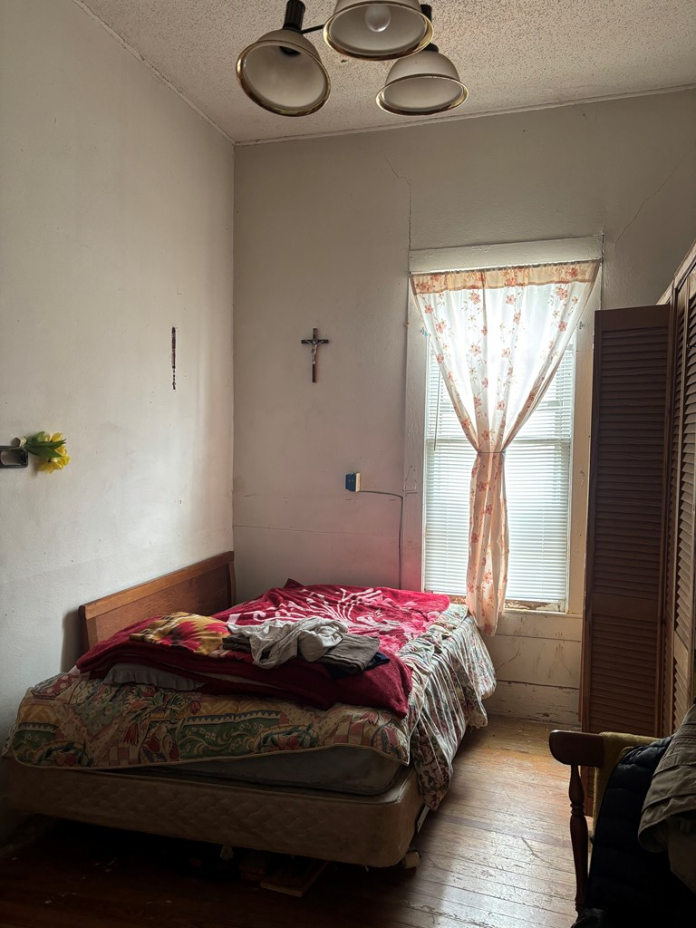 725 Swigert Street Kerrville, TX 78028 - Photo 5 of 17 a bedroom with a bed and a window