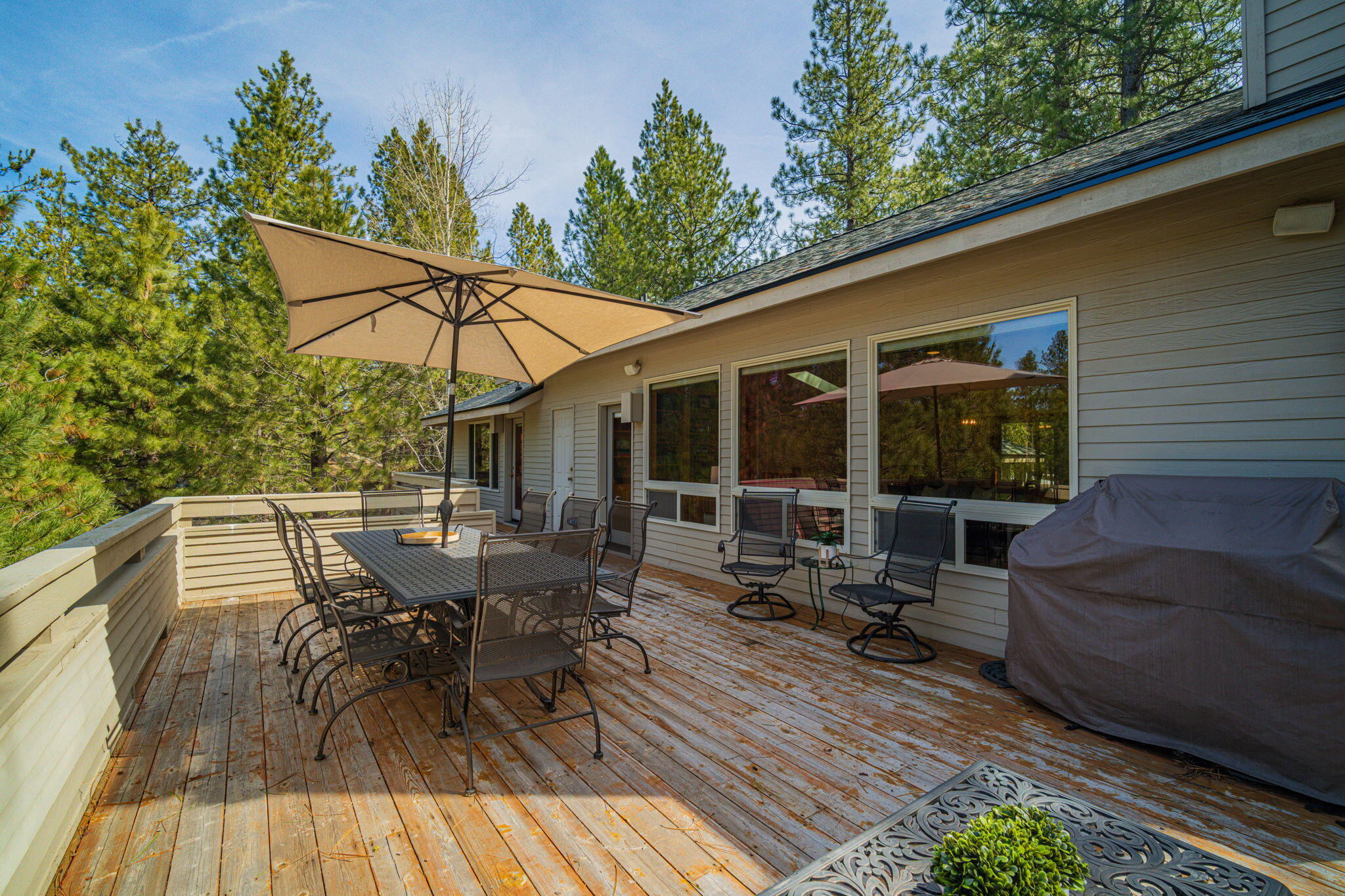 17948 Shadow Lane, Unit 7 Sunriver, OR 97707 - Photo 72 of 92 a view of backyard with outdoor seating and wooden floor