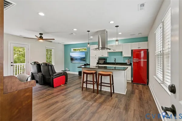 a spacious bathroom with a bathtub sink and mirror