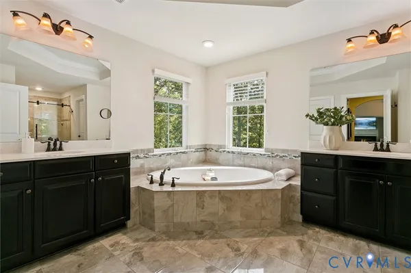 a bathroom with a granite countertop sink toilet and mirror