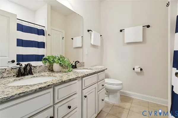 a room with pool table and windows